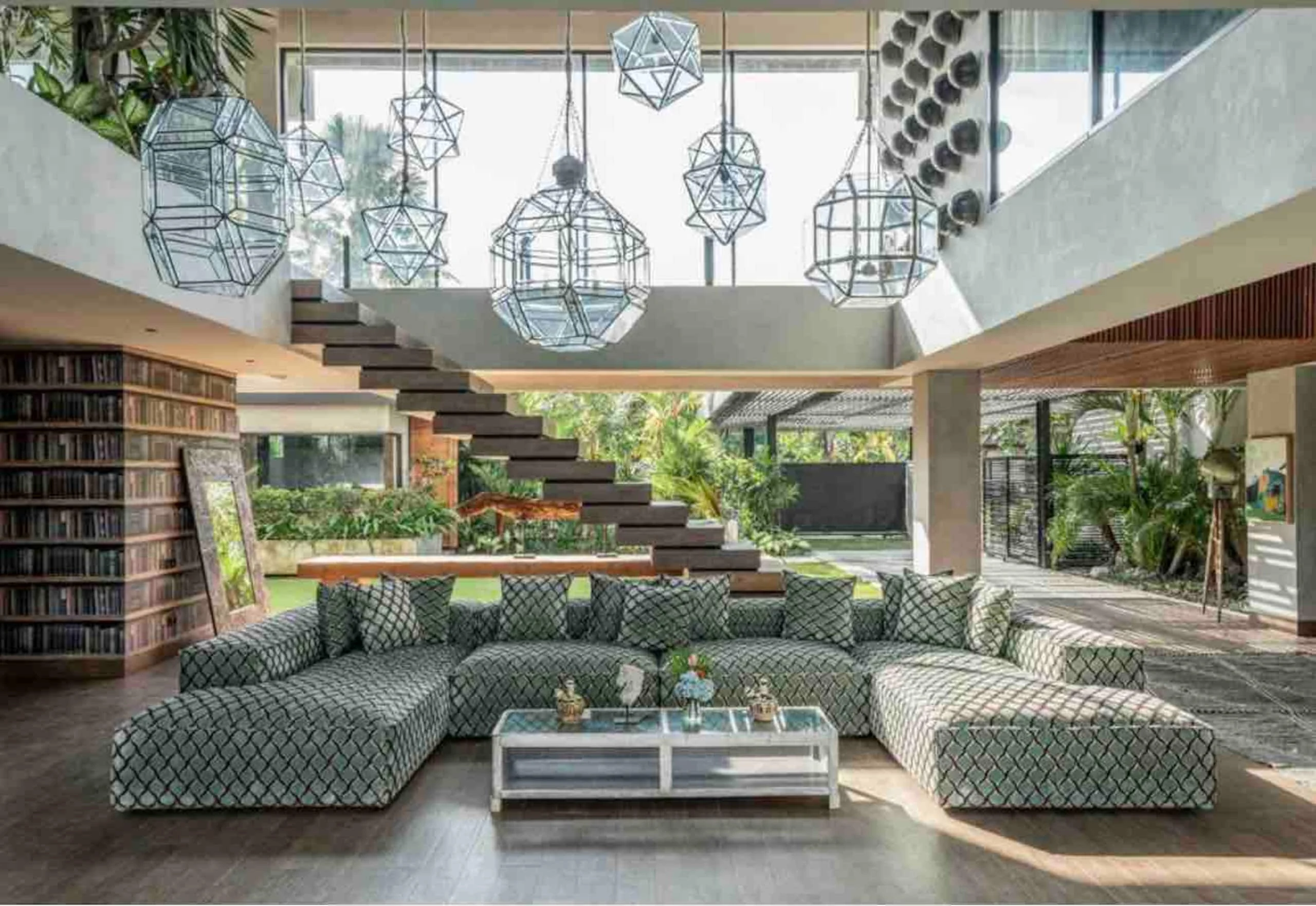 Sculptural staircase above the villa's green sunken lounge