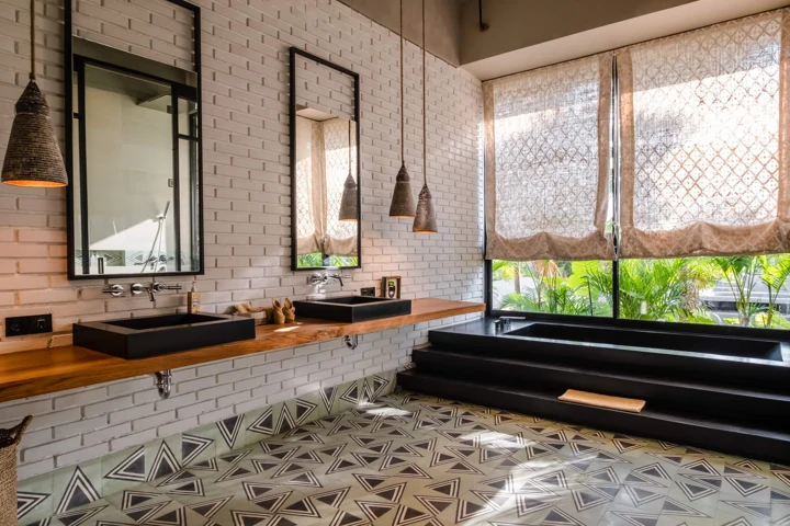 Bathroom with a double vanity and sunken bathtub