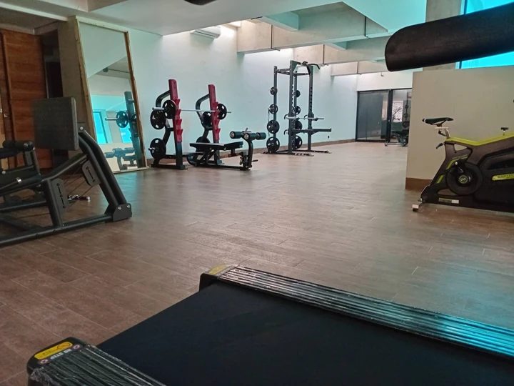 Fitness room with weights and exercise equipment
